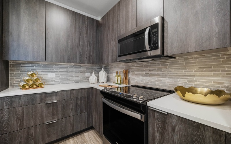 kitchen with quartz countertops with full-height backsplashes